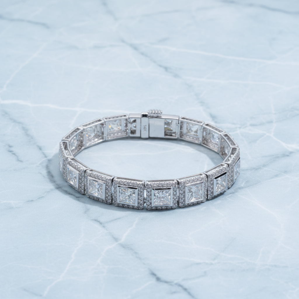 Diamond bracelet on a white surface with greenery in the background