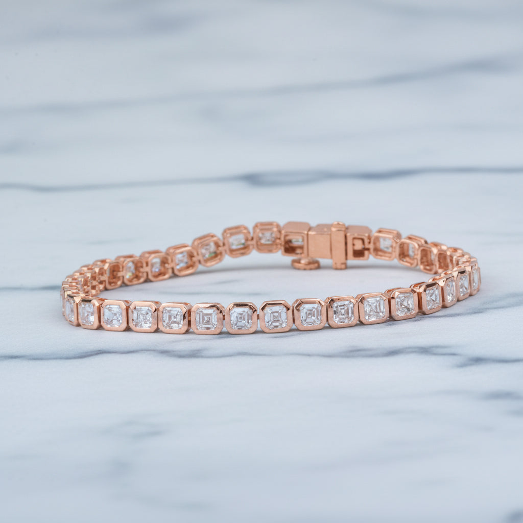 Rose gold bracelet with diamonds on a beige surface with green leaves in the background