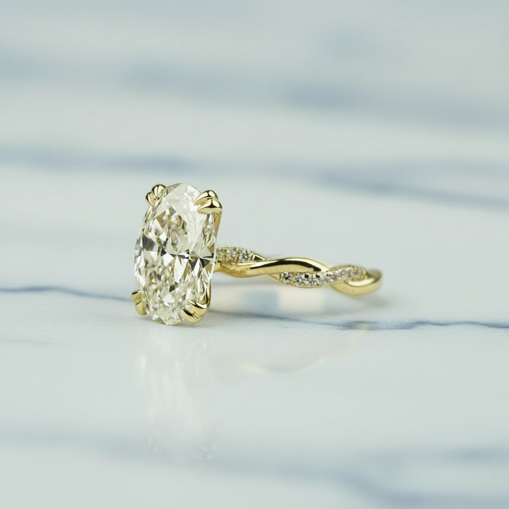 Gold ring with a large diamond on a light background