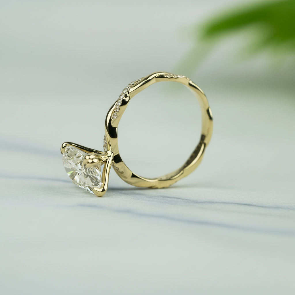 Gold ring with a diamond on a light green background
